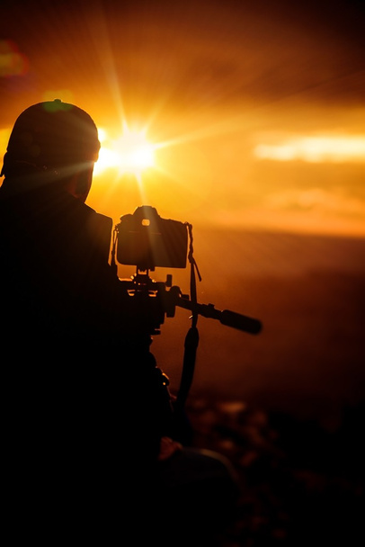 stock-photo-taking-pictures-at-sunset